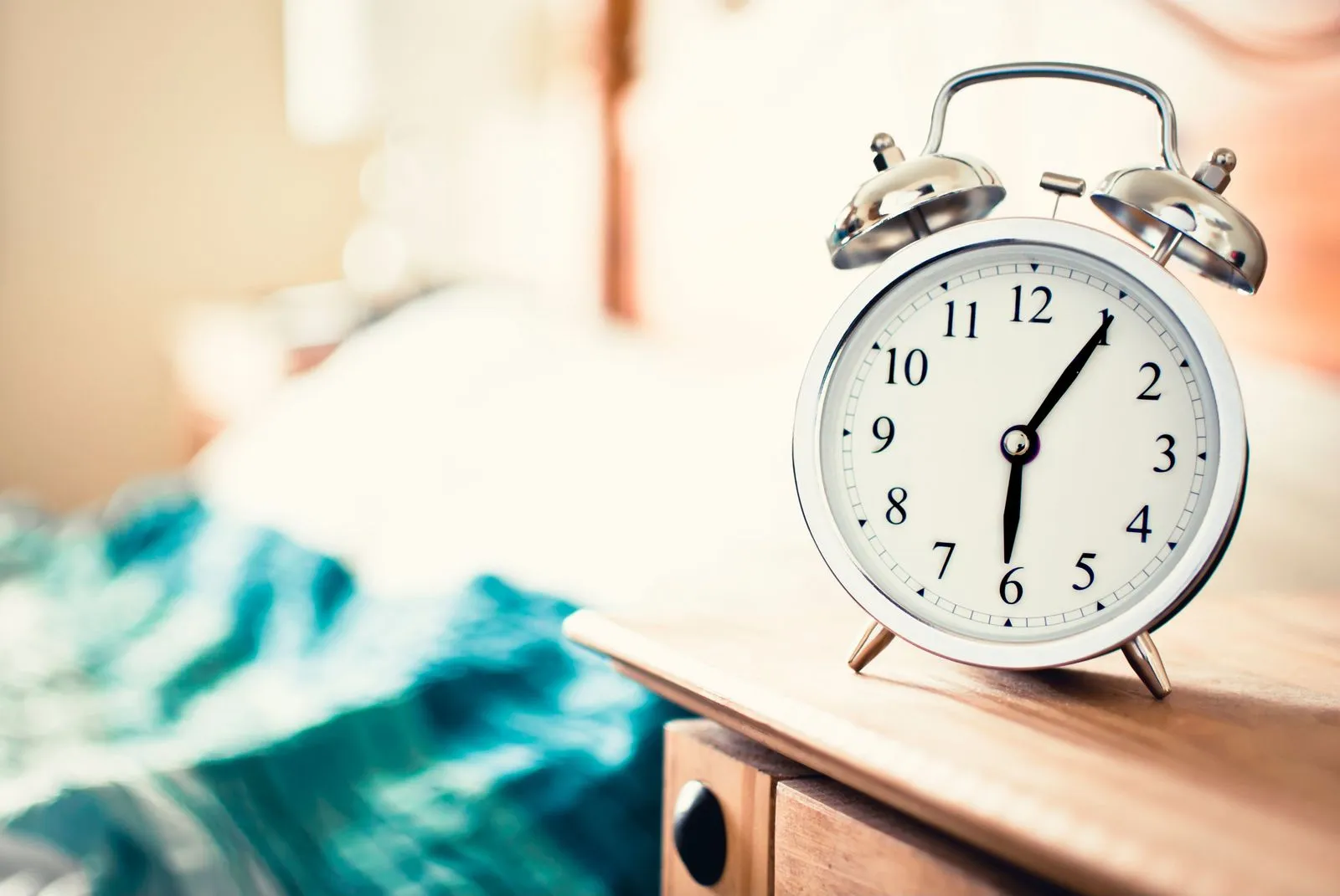 Morning wake-up: alarm clock by the bed as part of a mindful morning routine
